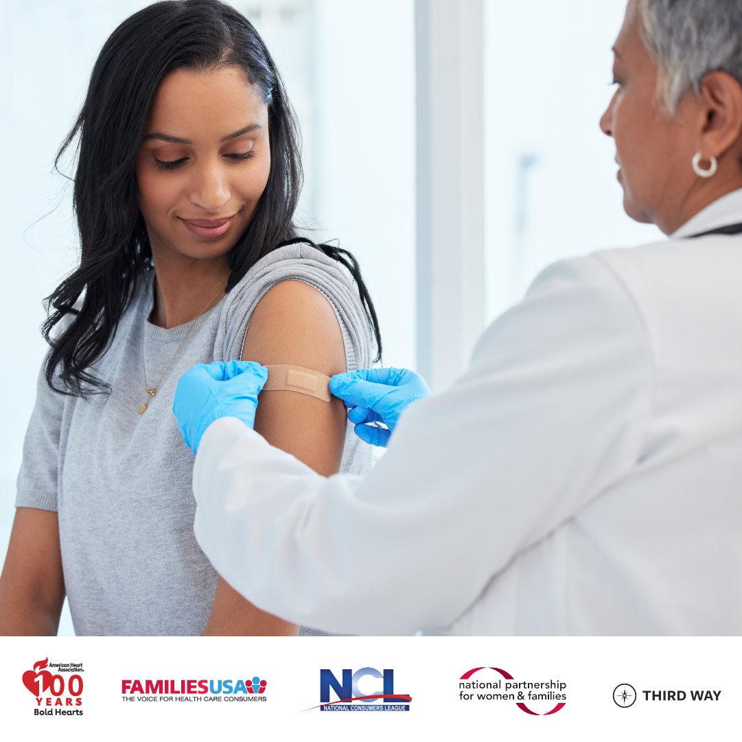 Image of doctor and patient with doctor administering a vaccine